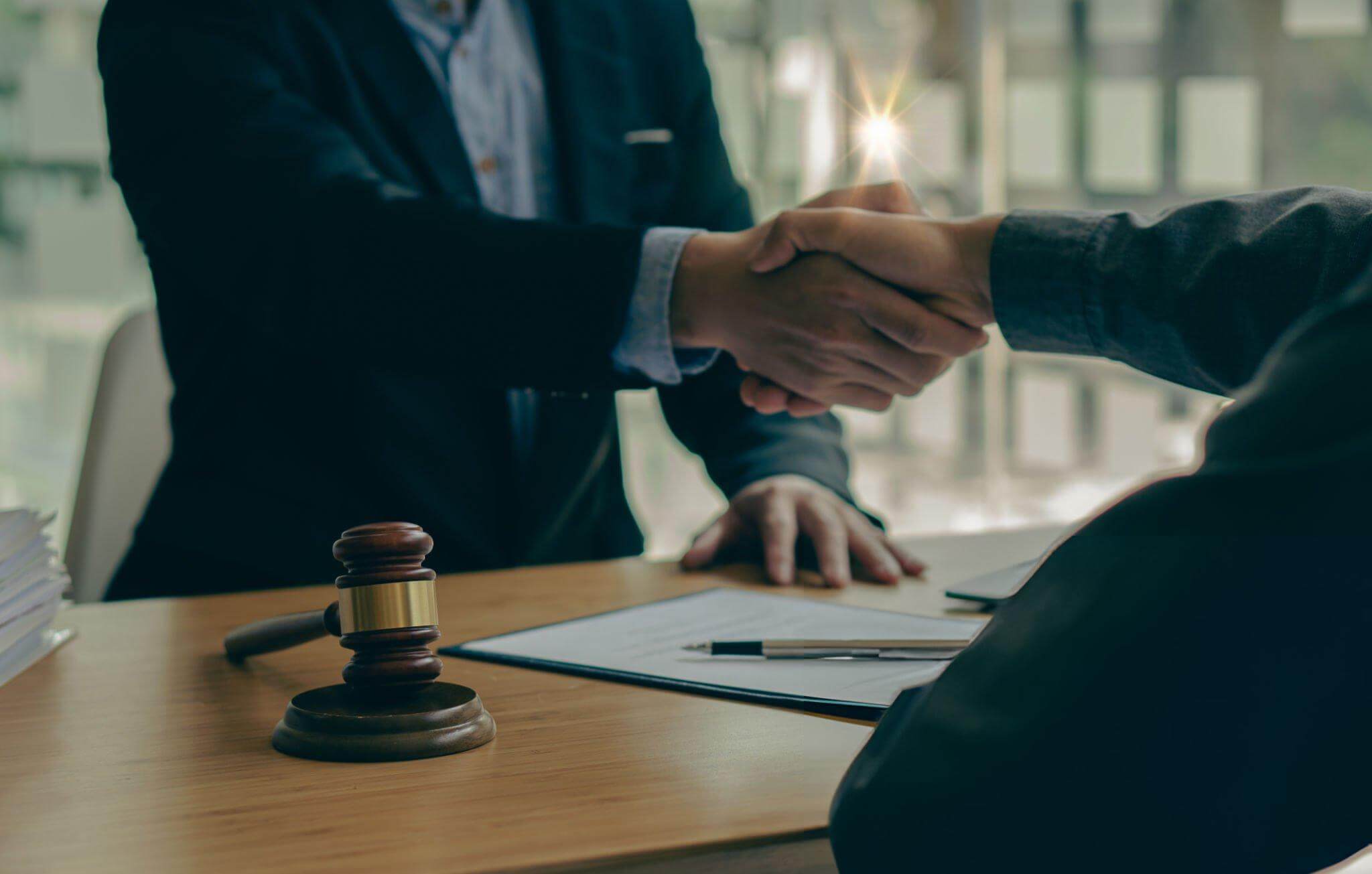 Attorney and client discussing documents during a first reinstatement consultation in an Illinois law office.